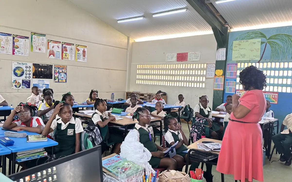 A classroom full of students in the middle of their class.